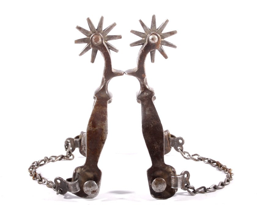 August Buermann Drop Shank Spurs c. 1880-1890: The lot features a set of early forged steel drop shank California spurs attributed to August Buermann. The spurs are from circa 1880-1890 and are not marked, but match the California Drop Shank spurs
