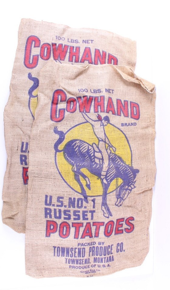 Townsend Montana Burlap Potato Sacks: This lot features a collection of two Townsend Montana burlap potato sacks. Both burlap sacks have elegant painted designs which are not faded. Both bags are in good condition for there age. Measure: 