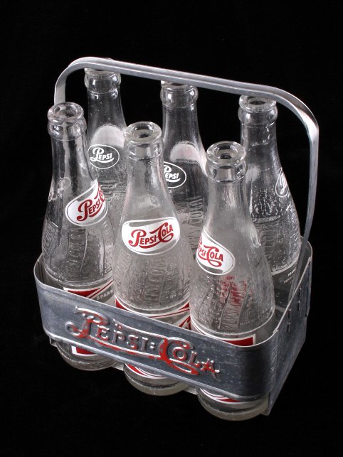 Vintage Metal Pepsi-Cola Six Pack With Bottles: This lot features a vintage metal Pepsi-Cola soda six pack with bottles. The metal case is in good condition for its age and still features most of its original paint. The Pepsi- Cola logo is very vis