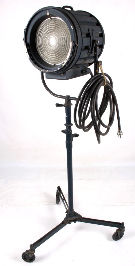 Antique Art Deco Cinefonics Theatre Light: This lot features an antique art deco theater light. The is on a rolling base and still functions. Its style and design date the piece to the 1930's-1940's America. The piece has been fitted with mode