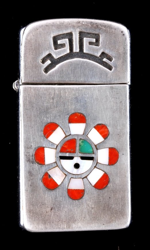 Zuni Indian Sterling Silver Inlaid Zippo Lighter: This is a Zuni Indian sterling silver inlaid Zippo lighter. The lighter shows in inlay of the Sun Face made with coral, mother of pearl and turquoise. The lighter is marked "Zippo" and shows good over