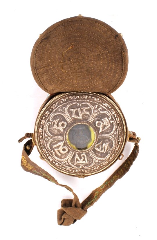 Early Tibetan "Gau" Or Prayer Box: This lot features a early Tibetan "Gau" or prayer box. This box where often made of tin and silver. They where use to hold scared objects inside them.There has been debate over whether the prayer box