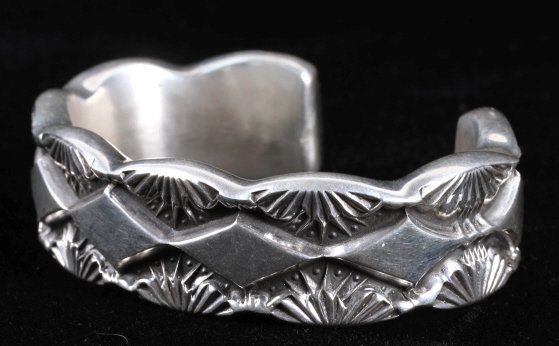 Navajo Marc Antia Heavy Sterling Silver Bracelet: This is an excellent very heavy construction sterling silver bracelet by master Navajo Native American Indian silversmith, Marc Antia. The piece has a unique heavy tooled shadow box hand tooled design