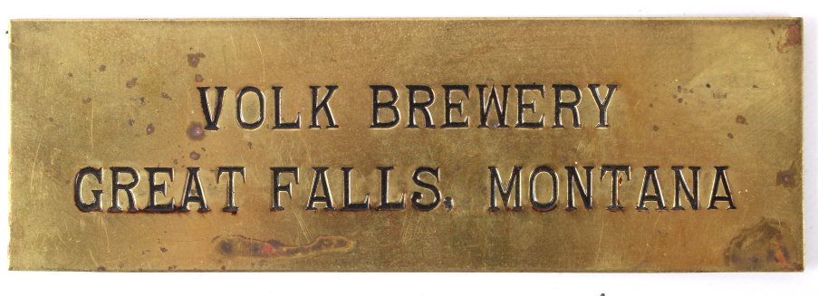 Volk Brewery Brass Sign Great Falls, MT C.1930's: This lot features a Volk Brewery brass sign advertisement from Great Falls, Montana. Volk Brewery was in business from 1935-1950. This piece is in good condition for its age, showing minor tarnish. It