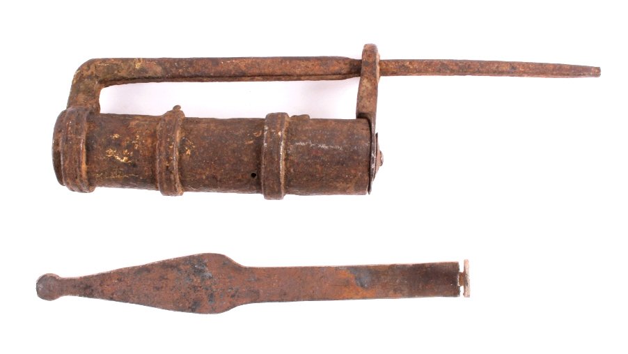 Blacksmith Forged Iron Lock and Key: This is a primitive blacksmith forged iron lock and key. The iron "key" is used to depress the springs on the shackle to open it. The lock is in good overall condition. It measures 10.5" long.