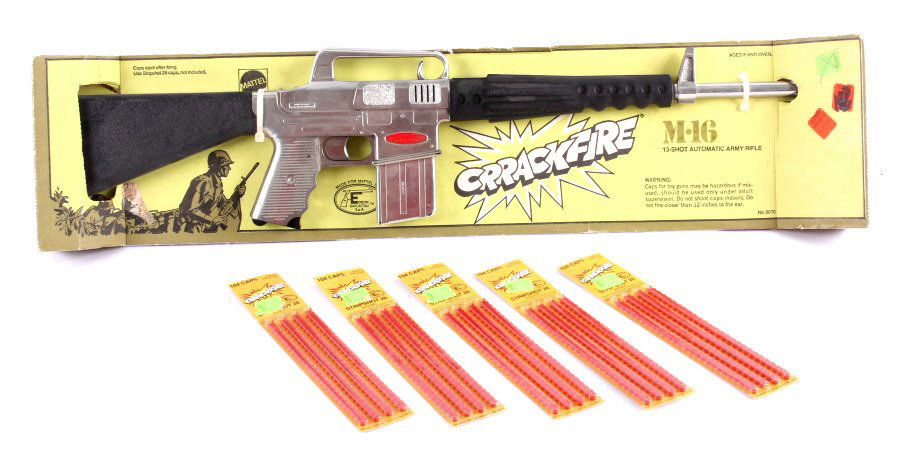 Mattel M-16 Toy Rifle with Caps: This is a Mattel M-16 toy rifle with caps. The rifle is new in the box with the original packaging. It comes with five packages of caps. The rifle measures 28" long.