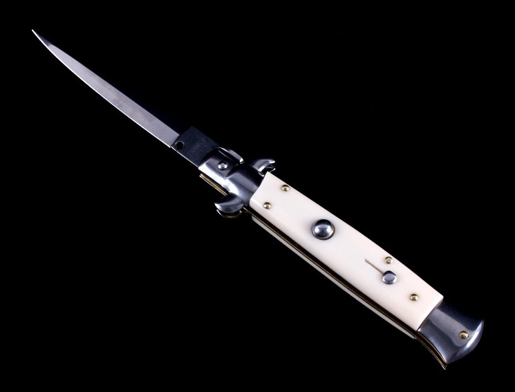 Frank Beltrame Stiletto Switchblade Knife: This is a Frank Beltrame Italian stiletto switchblade knife. The knife is marked "Frank B Italy" and features an ivory toned celluloid handle. The knife shows very good condition. It measures 9" with 