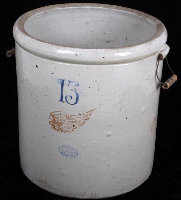 Red Wing 15 Gallon Crock Large Wing RARE: The lot features a good condition Red Wing Union Stoneware 15 Gallon crock with the rare large wing and number on the front. The front shows great paint and no visible cracks. Measures 18" D x 19" H