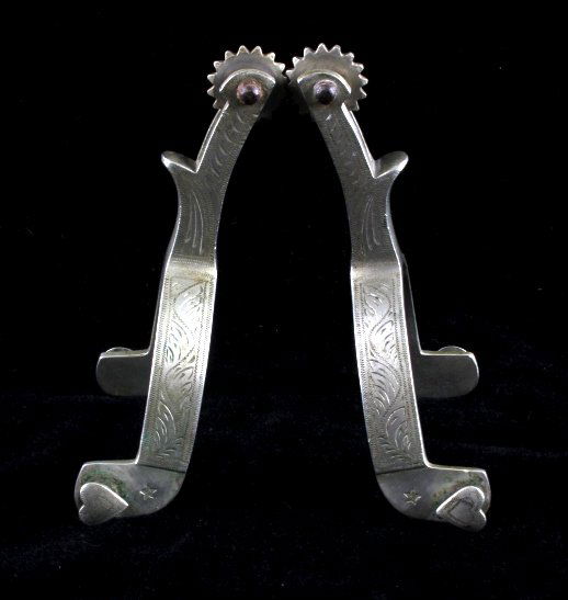Buermann Star Steel Silver Engraved Spurs: This is a pair of Buermann Star Steel Silver engraved spurs. The spurs are marked with the "AB" inside the star maker's mark under the outside heart buttons. The other buttons are marked "Star Steel S