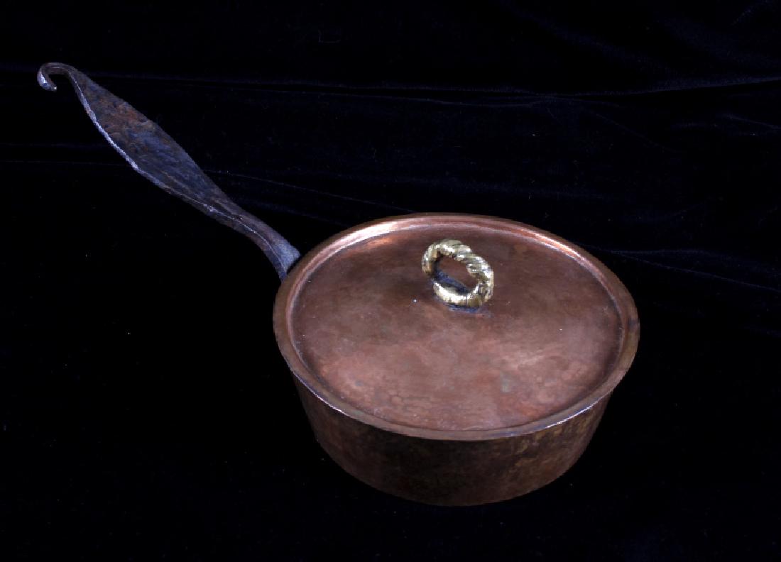 Hand Forged Hammered Copper Sauce Pan: This lot features a hand forged hammered copper pot. The pot was made by hand form copper. The piece shows good craftsmanship. It is in good condition for its age. Measures: 13" W x 6" Diameter x 2 3/