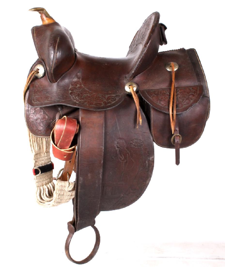 Rare R.T Frazier Custom Beartrap Saddle c 1900-15: This is an original early R.T. Frazier hand crafted saddle from Pueblo, Colorado. This saddle features beautiful tooled designs, including scantily clad ladies and the ranches brand. The saddle also h