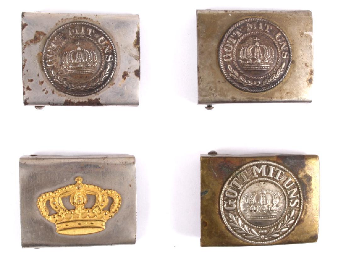 Early WWI Prussian Military Belt Buckles c1910-15: This lot features four belt buckles from the first world war. Three of them have roundels with the phrase "Gott Mit Uns" (God is with us). One of the buckles is from before the war due to its brass co