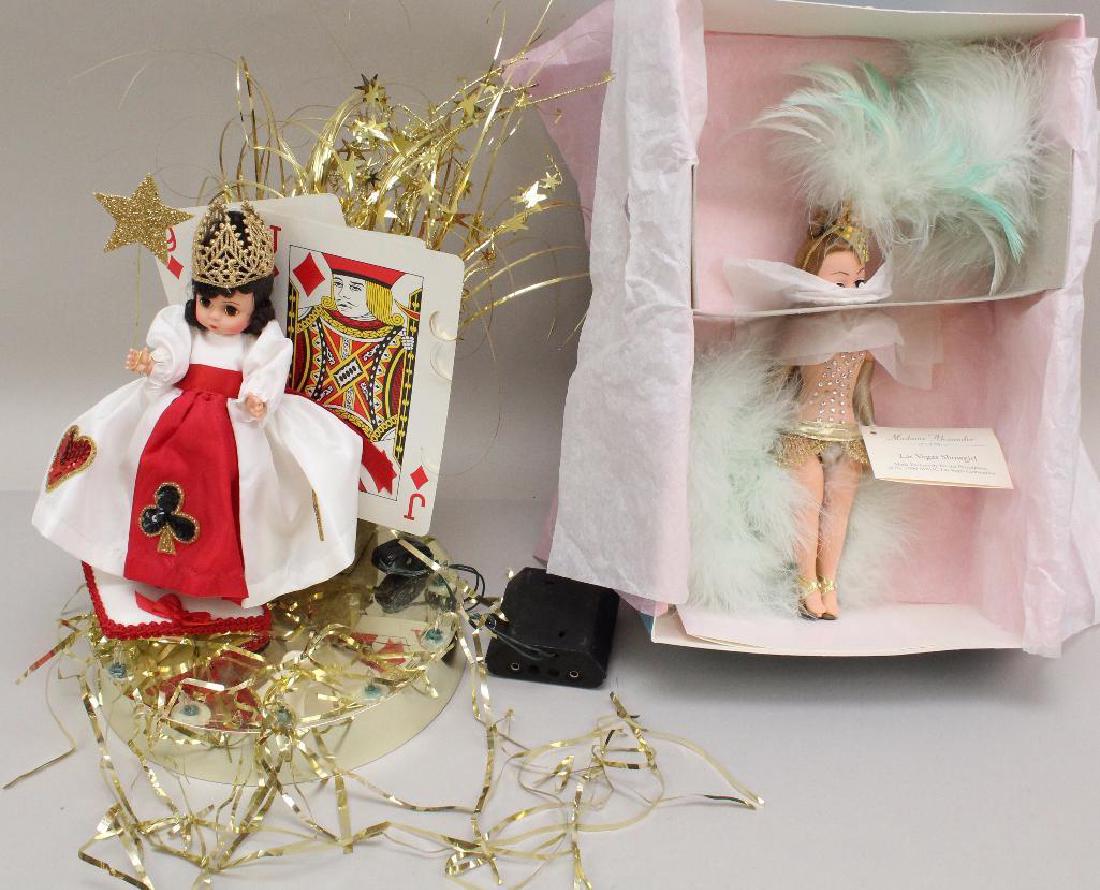 PAIR OF 1996 MADAME ALEXANDER DOLLS FROM LAS VEGAS: These dolls came from the 14th National MADC Convention. 8" Centerpiece doll on original centerpiece base with (3) oversized playing cards. Also has the 1996 MADCC Ann Rast stand. Condition: base has 
