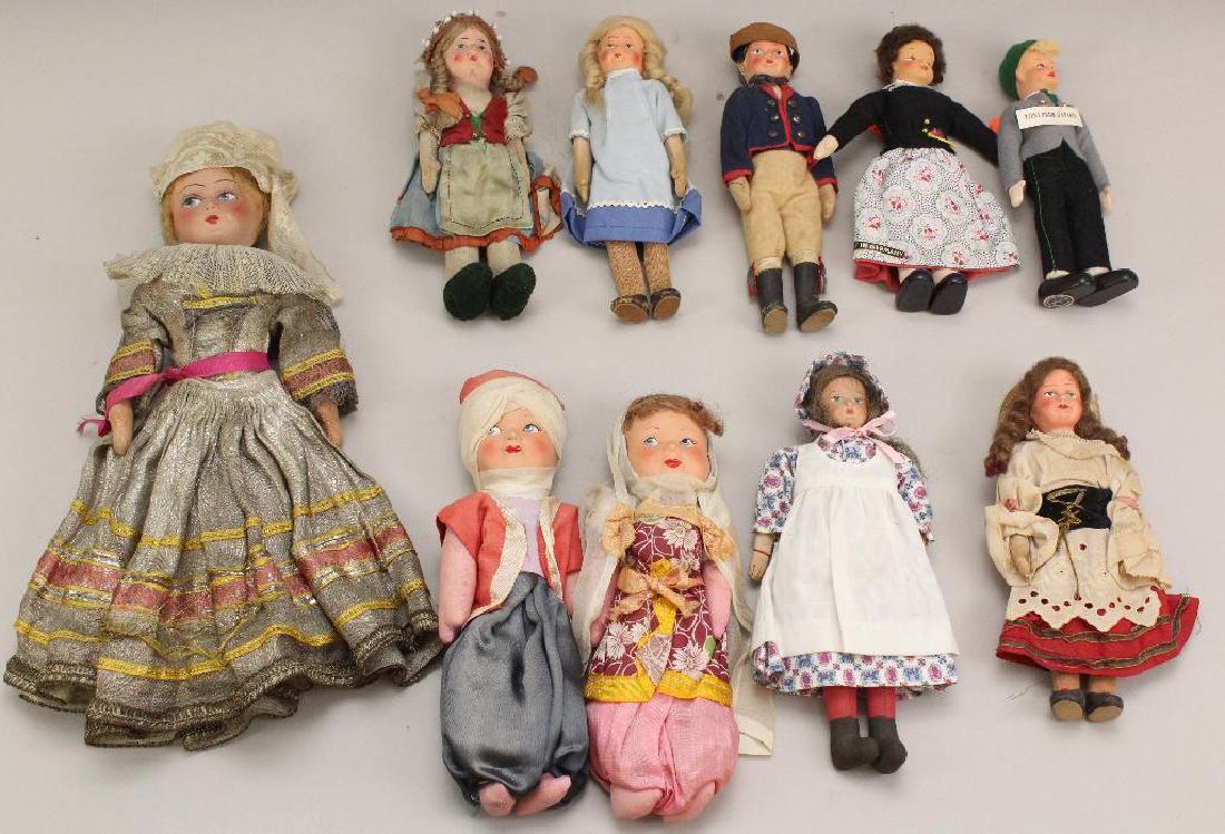 LOT OF (10) VINTAGE DOLLS FROM OTHER COUNTRIES.: 1930's-1940's. Heads are made from different materials: papier mache, composite, mask face. Clothing appears original on all but (2). Condition: age discoloration/loss to clothing. This lot is being s