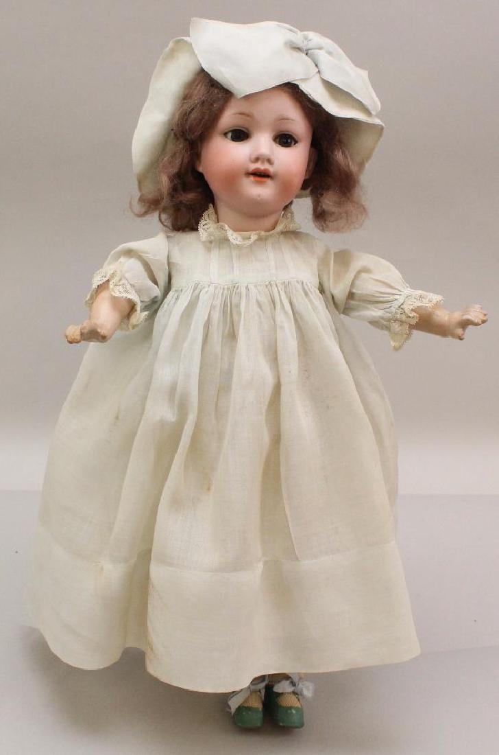 17" MADE IN GERMANY ARMAND MARSEILLE 390n. A.2.M.: This is an original family owned doll. Blue sleep eyes, closed mouth, brown mohair wig. Papier mache stick body. Dressed in antique clothing: pale blue dress with matching hat; cotton underwear. Turqu