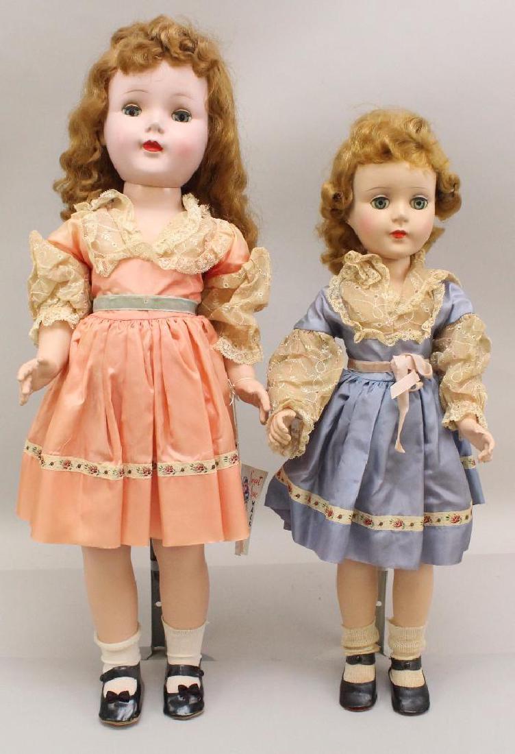 PAIR OF ALL ORIGINAL AMERICAN CHARACTER "SWEET SUE": Both dolls have blue sleep eyes, honey blonde saran wigs and are wearing identical outfits except they are different colors. 21" Doll is wearing a blue dress, original shoes/socks. Nice coloring. Hair