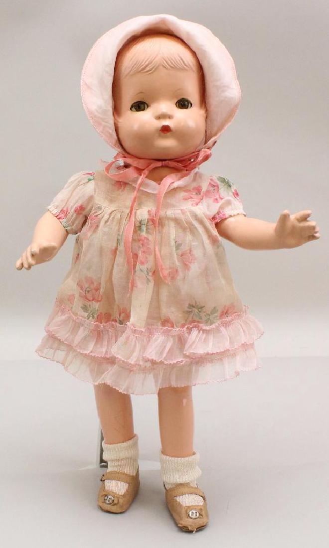 16" EFFANBEE COMPOSITION "PATSY JOAN" DOLL.: Green sleep eyes. Unpainted molded hair (and evidence that doll was originally wigged). Dressed in floral organdy dress with companion bonnet. No underwear. Pink oilcloth shoes, socks. Condition: craz