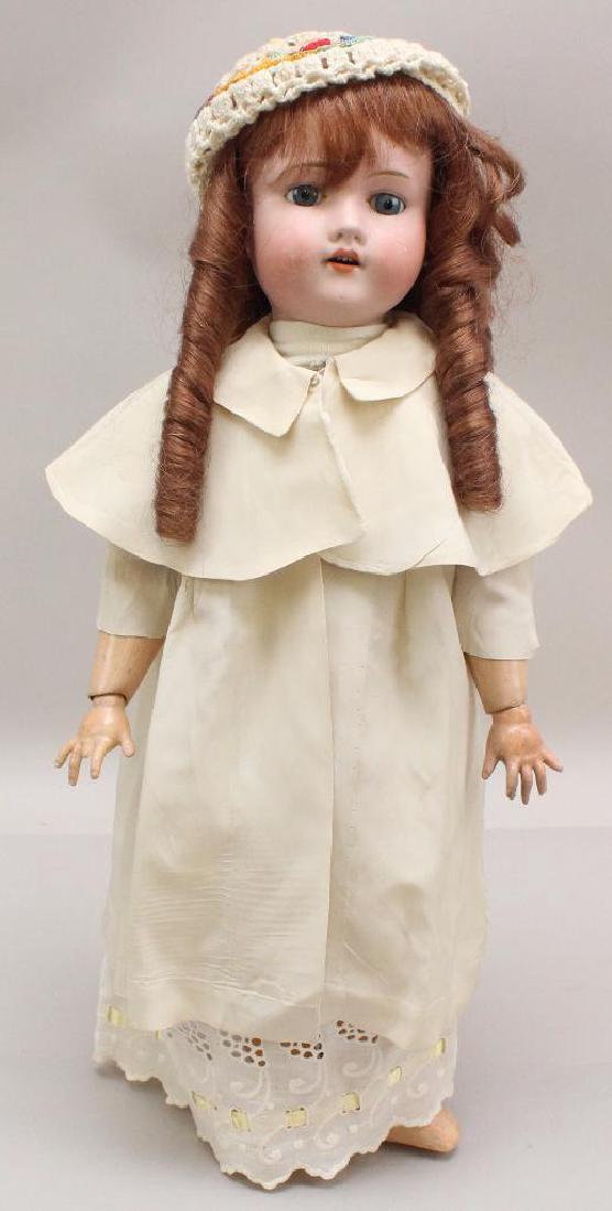 18" MADE IN GERMANY METZLER 890 / 3 E. M. ANTIQUE: Stationary blue eyes, open mouth, replaced wig. Papier mache ball jointed body. Dressed in some antique/vintage clothing. No shoes, socks. Condition: rubs on both cheeks. Both feet and (1) hand have h