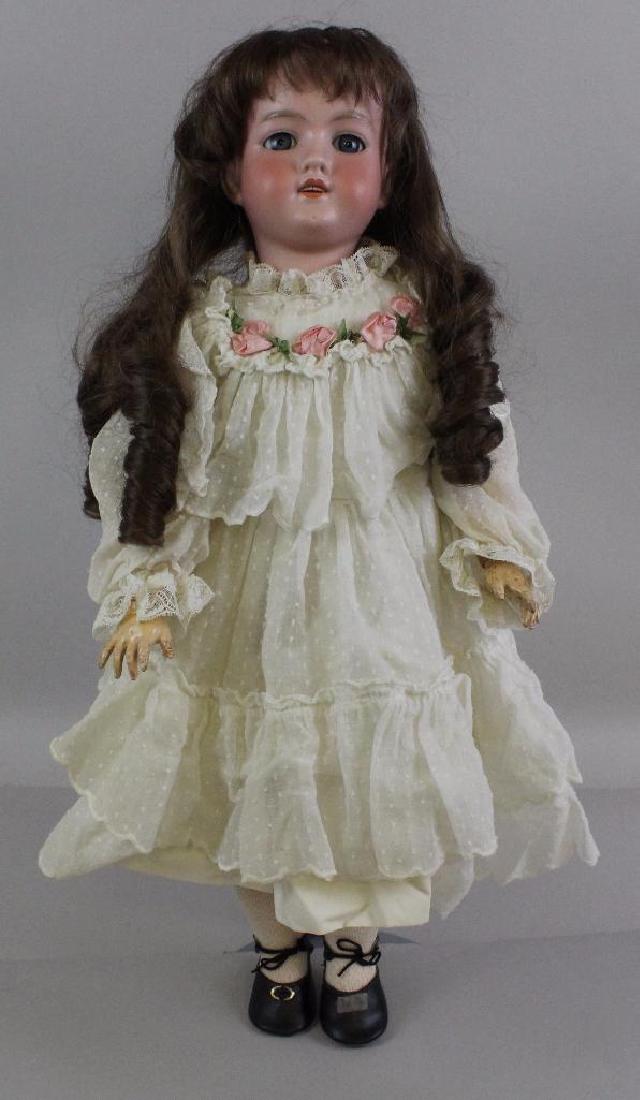 22" MADE IN GERMANY C.M. BERGMANN A.7.M. ANTIQUE BISQUE: Blue sleep eyes, open mouth, replaced wig. Papier mache ball jointed body. Dressed in vintage/antique white cotton clothing. Newer shoes, socks. Condition: minor kiln specs on bisque after examination