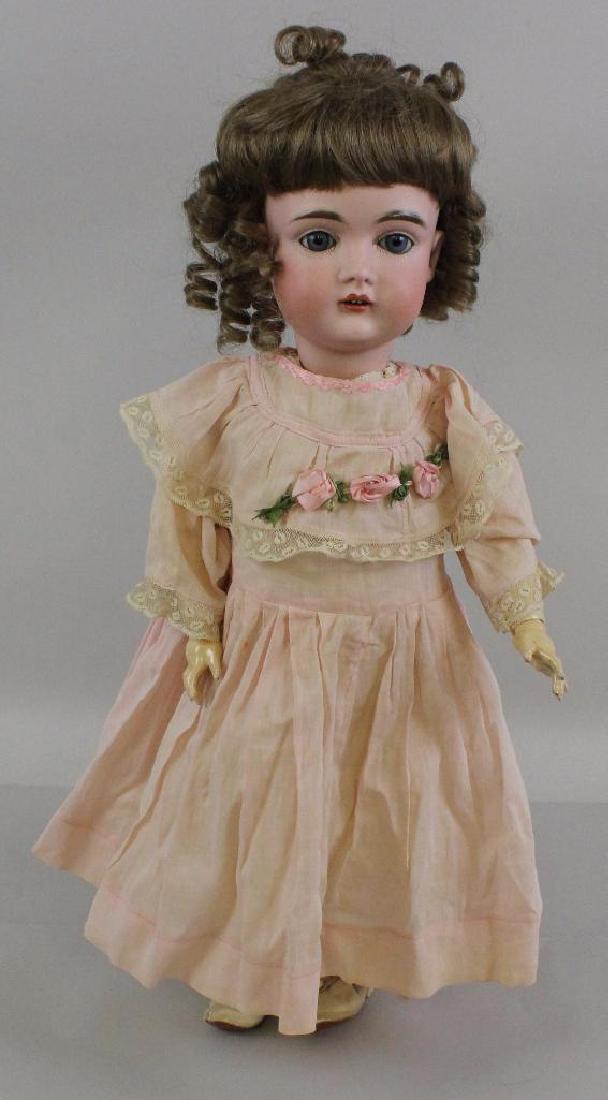 19" 5 1/2 MADE IN GERMANY 10 1.2 167 ANTIQUE BISQUE: Blue sleep eyes, open mouth, replaced wig, plaster pate. Papier mache ball jointed body. Dressed in antique cotton clothing , white leather heeled boots. Condtiion: tiny flake on right lower eye.