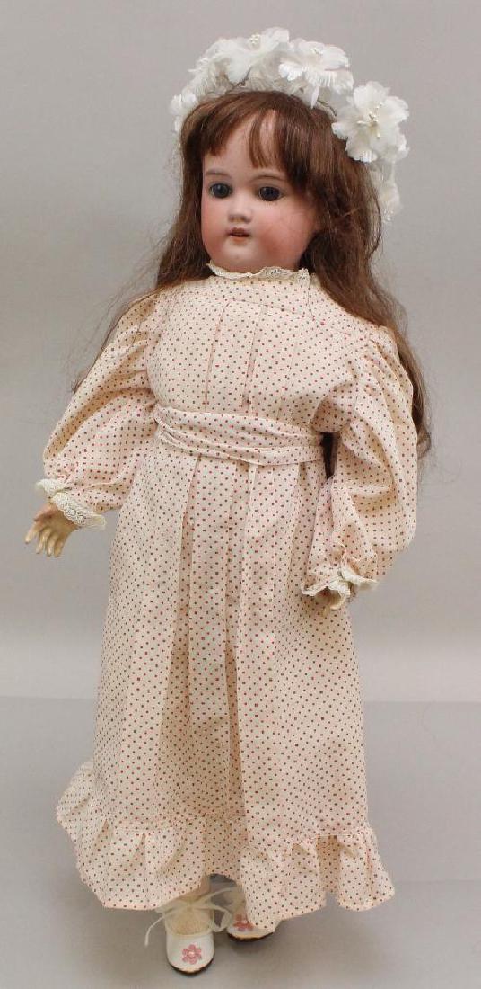 22" MADE IN GERMANY FLORADORA A.6.M. ANTIQUE BISQUE: Stationary blue eyes (that are on a rocker frame and could be reset properly to sleep), open mouth, replaced wig. Papier mache ball jointed body. Dressed in newer clothing, shoes, socks. Condition: no