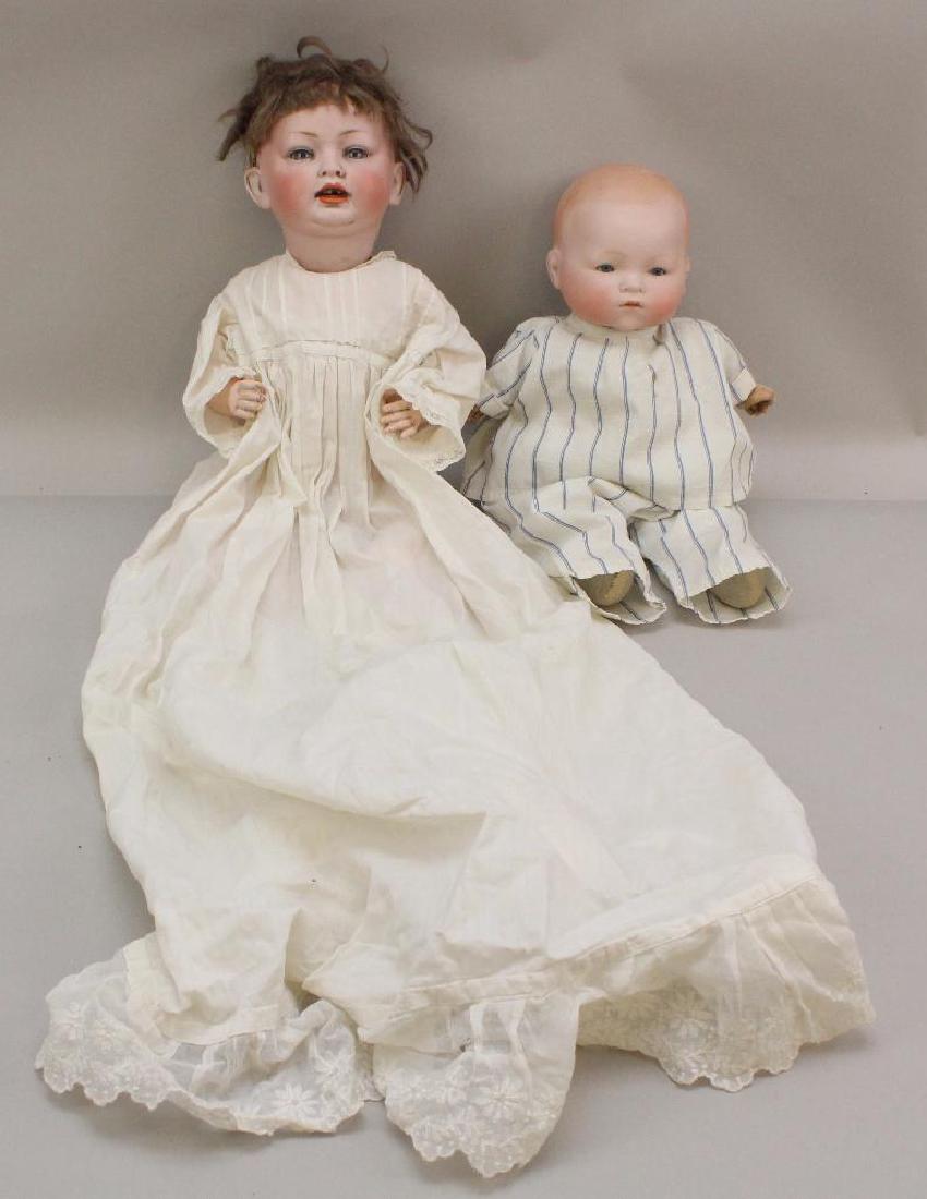 PAIR OF ANTIQUE BISQUE HEAD BABY DOLLS: 152 & AM 341.: Both dolls have blue sleep eyes. 17" Made in Germany 152 10 character baby with open mouth, brown mohair wig. 5 Pc. papier mache bent limb baby body. Dressed in antique child's baby gown only. Conditi