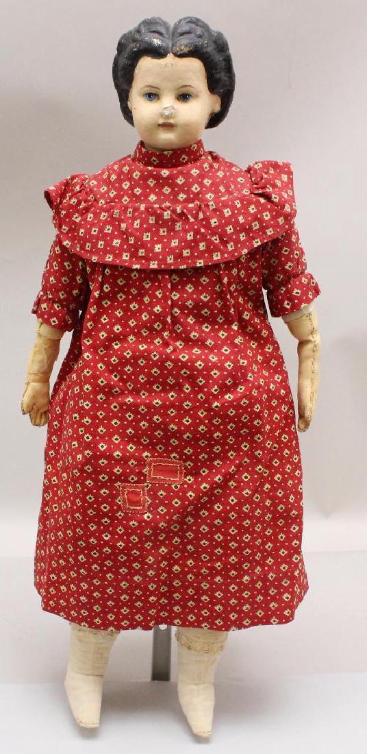 19" MARKED GREINER ' 72 ANTIQUE DOLL.: Provenance: tag reads -"Belonged to Emma Carll Elwell, Hancock's Bridge, NJ, Original clothes". Label on back reads: '58, Ext. '72 4th St., Phila. Painted black hair, blue eyes. Tan leather lower arms