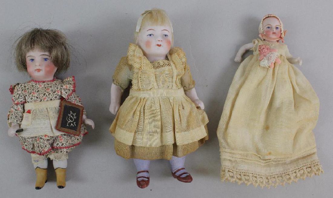 LOT OF (3) ALL BISQUE DOLLS WITH PAINTED EYES. (1 of 4)