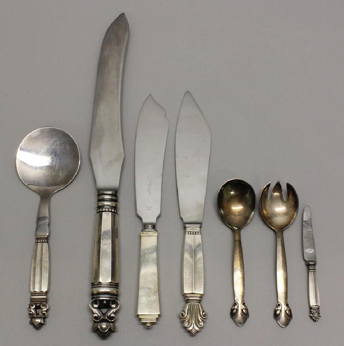 Group of Georg Jensen Sterling Silver Serving Pieces: Grouping of seven pieces includes: (2) "Acorn" pattern carving knife and bonbon server, designed by Johan Rohde in 1915. (2) "Bittersweet" pattern small salad serving pieces, designed by Gundorph