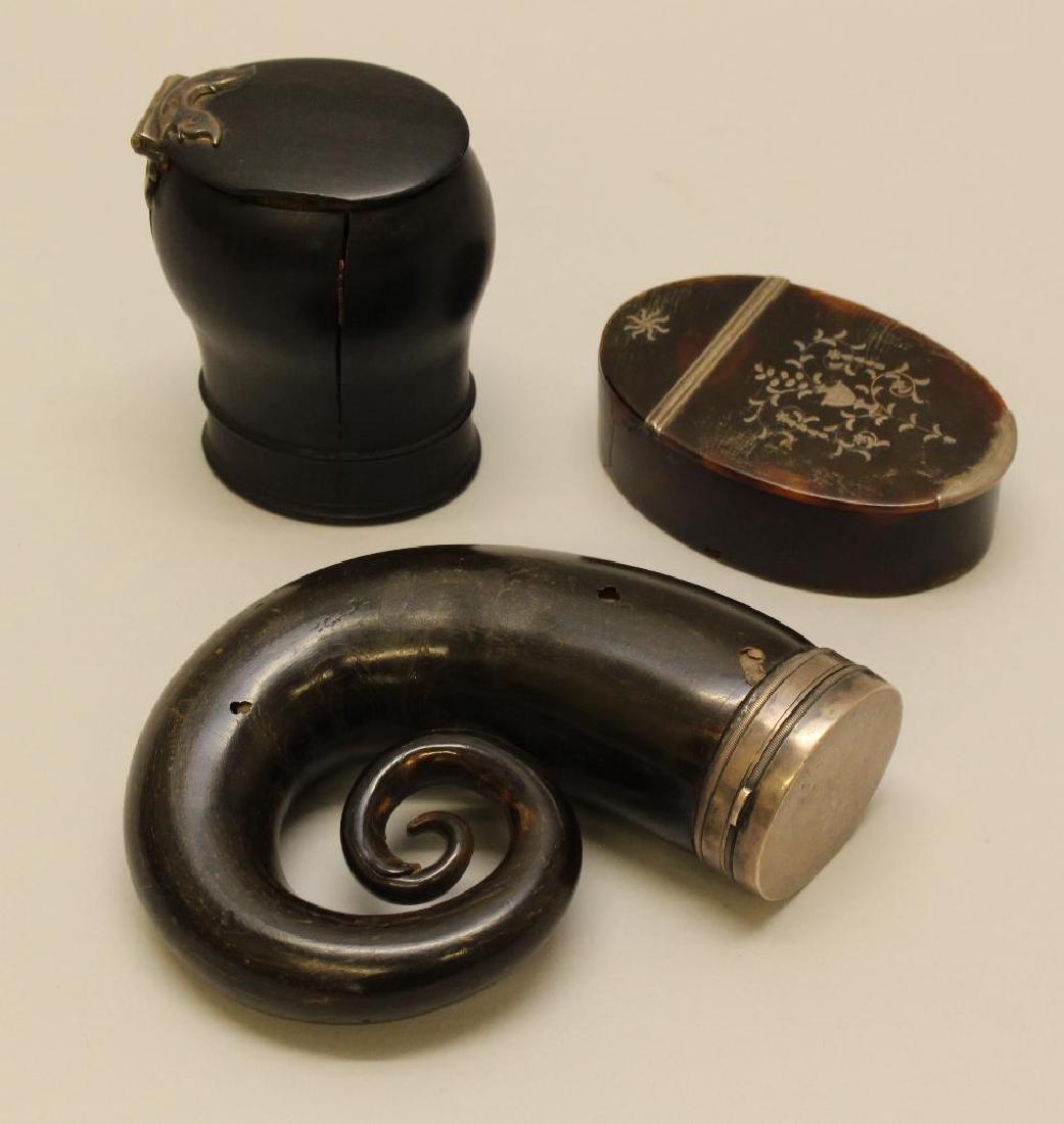 Lot of Snuff Horn and Two Boxes: Grouping of three boxes. Scottish snuff mull with silver lid, c. mid-19th century. Silver clasp closure lid. Wooden corset snuff box with silver hinged closure. Snuff box with decorative silver m
