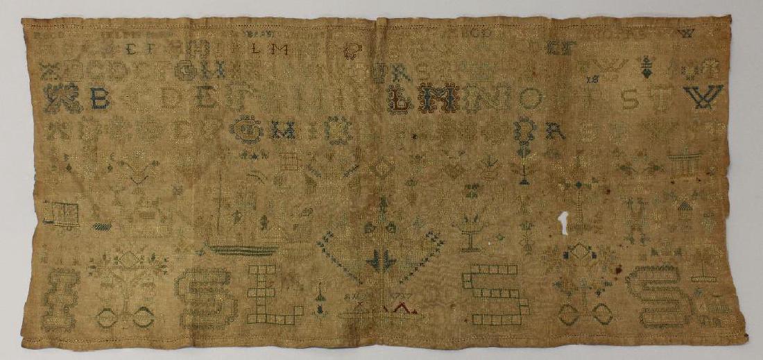 Alphabet Floral 1717 Needlework, Unframed: Alphabet needlework on linen with floral decoration throughout. Blues and some greens remain with a touch of red in the lower center of piece. Dated "1717" in lower center.11.75"h x 26"w