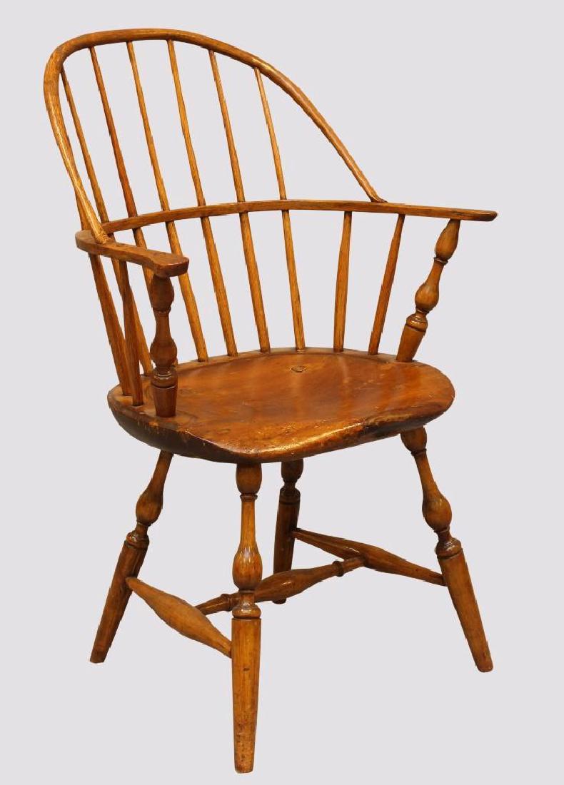 Sack-Back Windsor Armchair: Poplar with a saddle seat with turned splayed legs with an H stretcher, 
