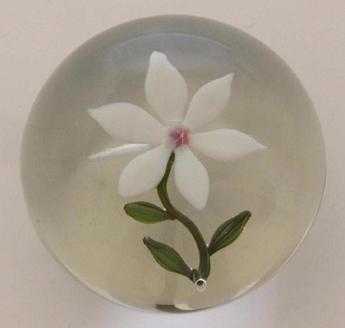 Paul Stankard (b 1943, New Jersey) White Flower: Lampworked glass. Botanical paperweight with single white flower. Marked "S" on underside of white peddle. 2"round.