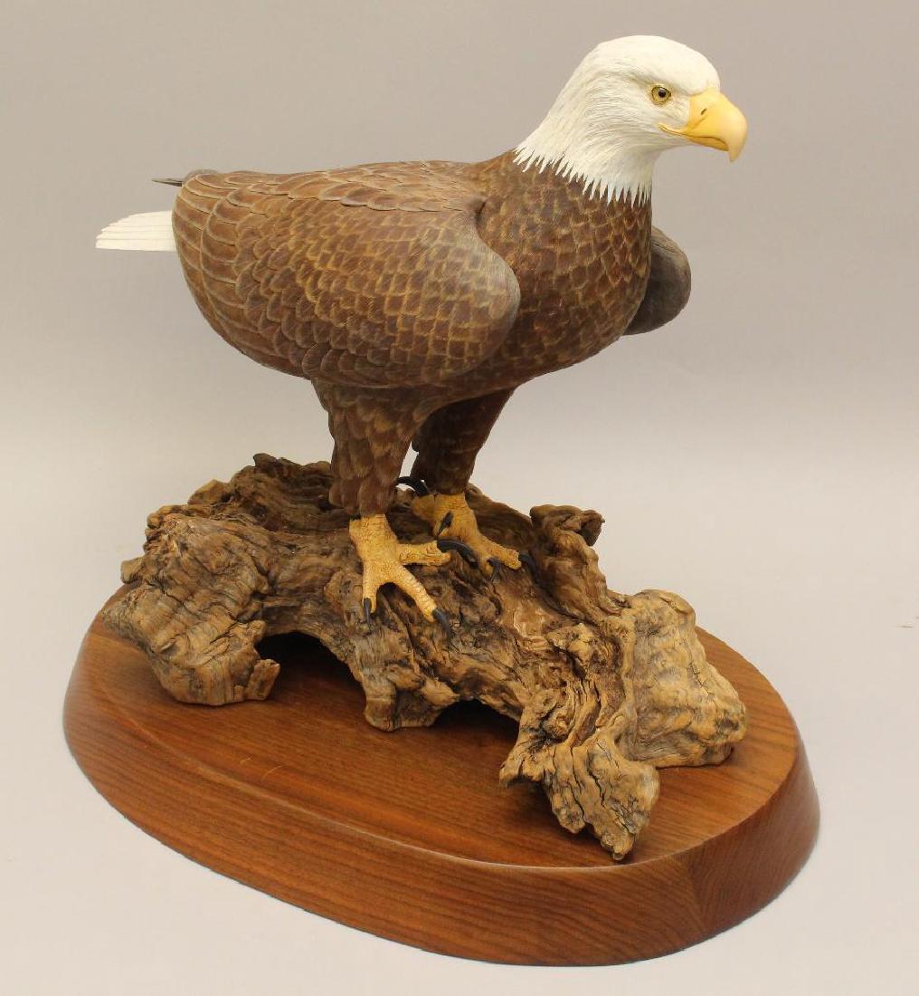 Painted and Carved Wooden Sculpture of a Bald Eagle: Unsigned on a walnut base, 17"h x 16"w.