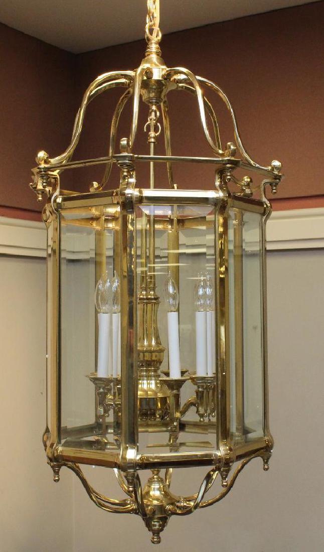 Brass Octagon Beveled Glass Chandelier: 8 light, 45.5"h x 22.5" w x 22.5"d. 56" ceiling plate to top of fixture.