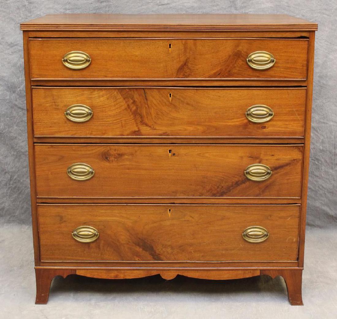 Hepplewhite Walnut Chest of Drawers: Four graduated drawers, scrolled apron on French feet, 40"h x 38.5"w x 22.5"d. 1.75" overhang off the back.