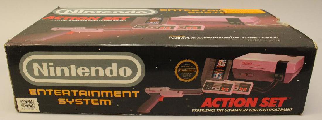 Nintendo Action Set: Unused with original box and all original parts which includes the control deck, two controllers, Zapper light gun, and Super Mario Bros. and Duck Hunt. Dated 1988 on box. 