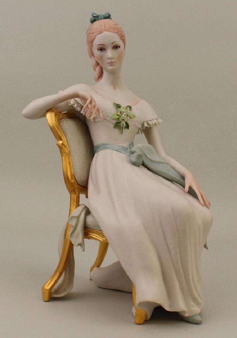 Cybis Porcelain Figurine "Scarlett": Marked Cybis # 392 on underside, 12"h x 7"w. Loss to the lace of the dress on the left shoulder.