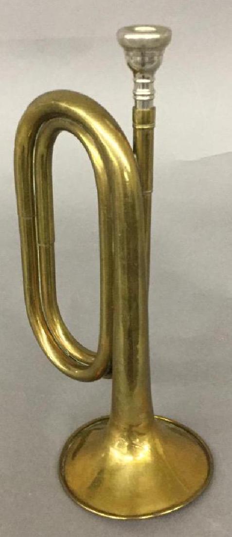 Brass Bugle: Brass taps bugle. Some creasing on bell. with mouthpiece.