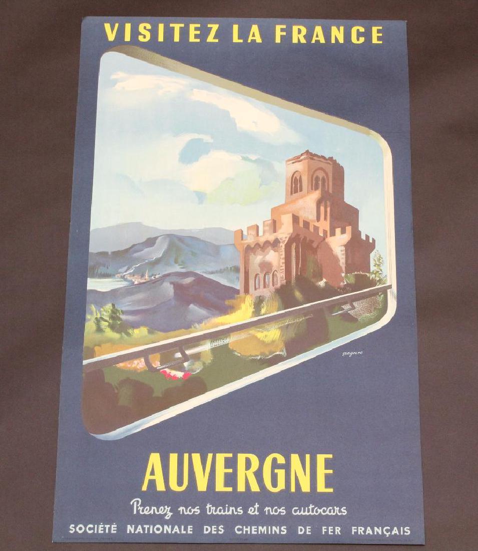 French Travel Poster: French travel poster for Aubergne. Graphics show view of village with castle in right foreground as viewed from window of a train. Poster measures 39" x 24" and exhibits some edge bumping with areas o