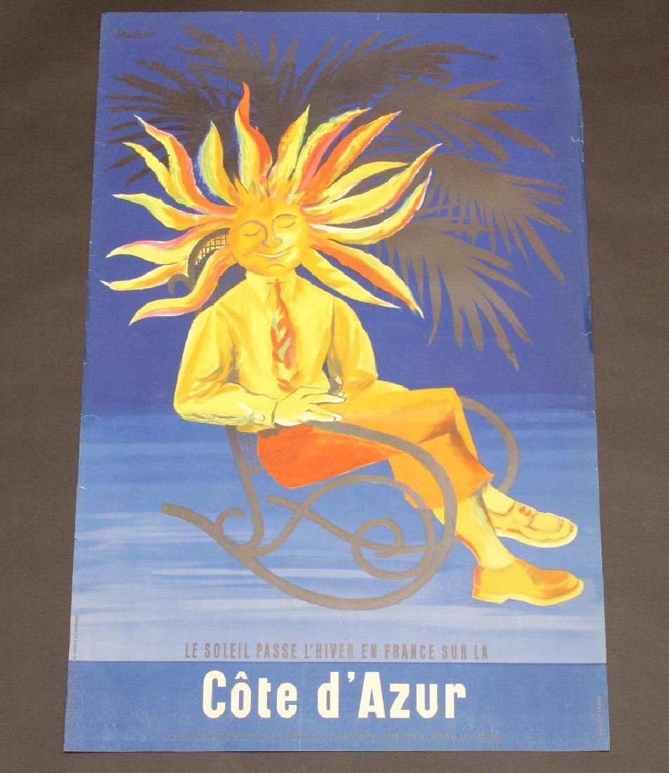 French Travel Poster: French travel poster for Cote D'Azur featuring graphics of a cartoon man with a sun head sitting in a rocking chair. Poster measures 39" x 25.5" and exhibits some edge tears with bend and underfold at
