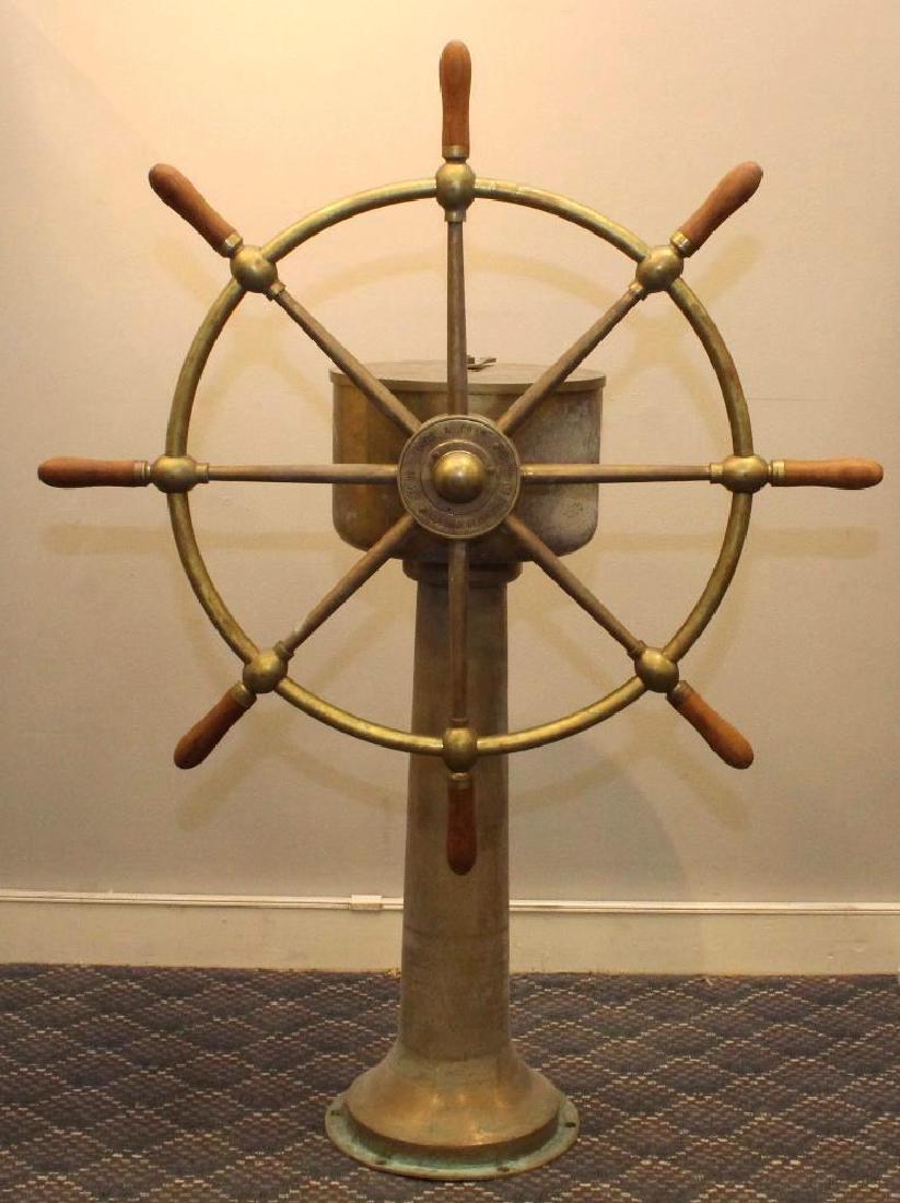 Brass ships wheel on pedestal: Brown Bros. , John Hastie Co. 14" D x 40" W x 44" H