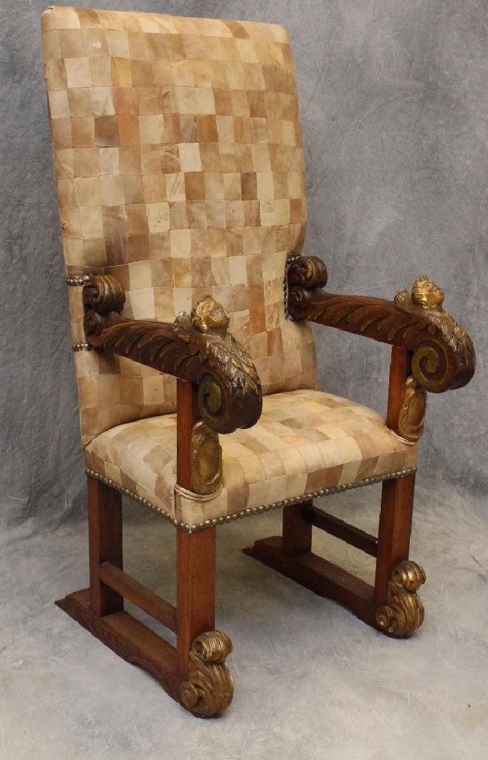 Ornate Carved Throne Chair: Scrolled cherub arms with C scroll trestle feet, checkered suede seat and back, 60"h x 27"w x 15"d.