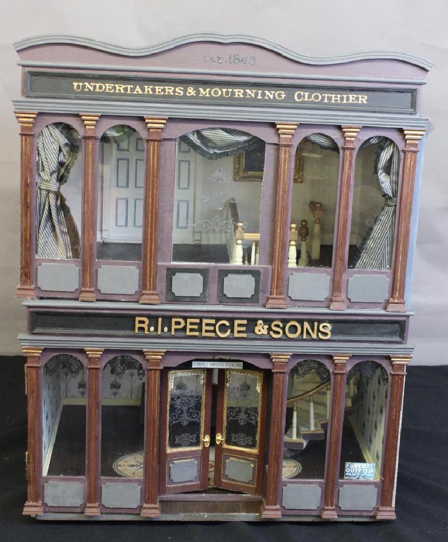 R.I. Peece Undertakers and Mourning Clothiers Dollhouse: Every town has an undertaker, so Smallsea had its own, R.I. Peece Undertakers and Mourning Clothiers. The building was inspired by a stunning 19th century era style funeral hearse. It was purchased at