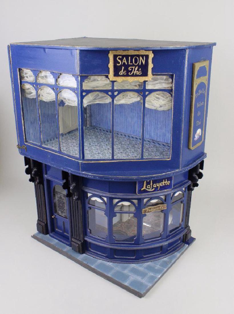 Lafayette Patisserie/La Belle's Tea Shop Dollhouse: The Lafayette Patisserie came to Smallsea as a one story shop made by Posterly Crafts, UK and repurposed by the Birnbergs. They added the top floor to include a fancy, High Street tearoom. The buildin