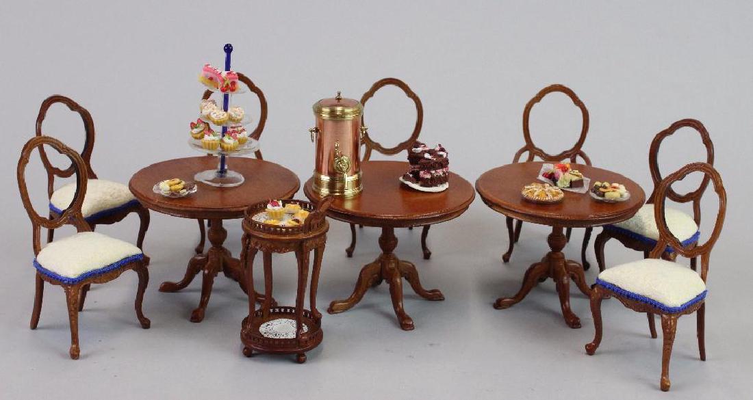 Tables chairs Bespaq; Tea cart urn;pedestal w pastries: 3 tea tables Bespaq; 7 chairs Bespaq; Tea cart with hot water kettle urn; and cakes, cookies and pedestal with pastries artists made AU