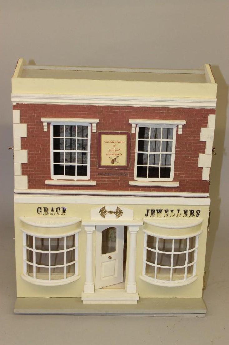 Grace Jewellers/Vivaldi's Violins: This building was made by the Birnbergs from a Sid Cooke UK two story shop kit. On the first floor is the jewelry shop, always a great treat for ladies visiting Smallsea, and the second floor is the v