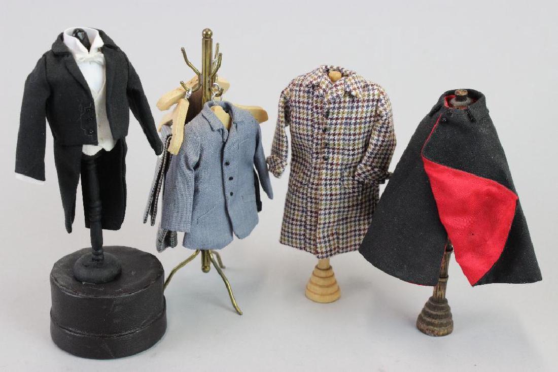Coat rack, clothes, mannequin: Coat rack with clothes - clothes by Susan Balfour; Opera Coat Susan Balfour; Mannequin with evening Tails Susan Balfour; Plaid coat Susan Balfour