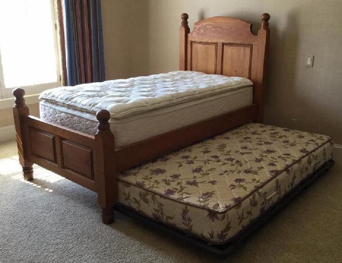 Hand carved single farmhouse bed: with mattress and trundle excellent condition. FRAME: 55"h x 44.5"w PLEASE NOTE: ITEM LOCATED AT 616 ALLENTOWN RD., TELFORD, PA. 18969. PICK UP IS 7/26 FROM 2 PM - 6 PM