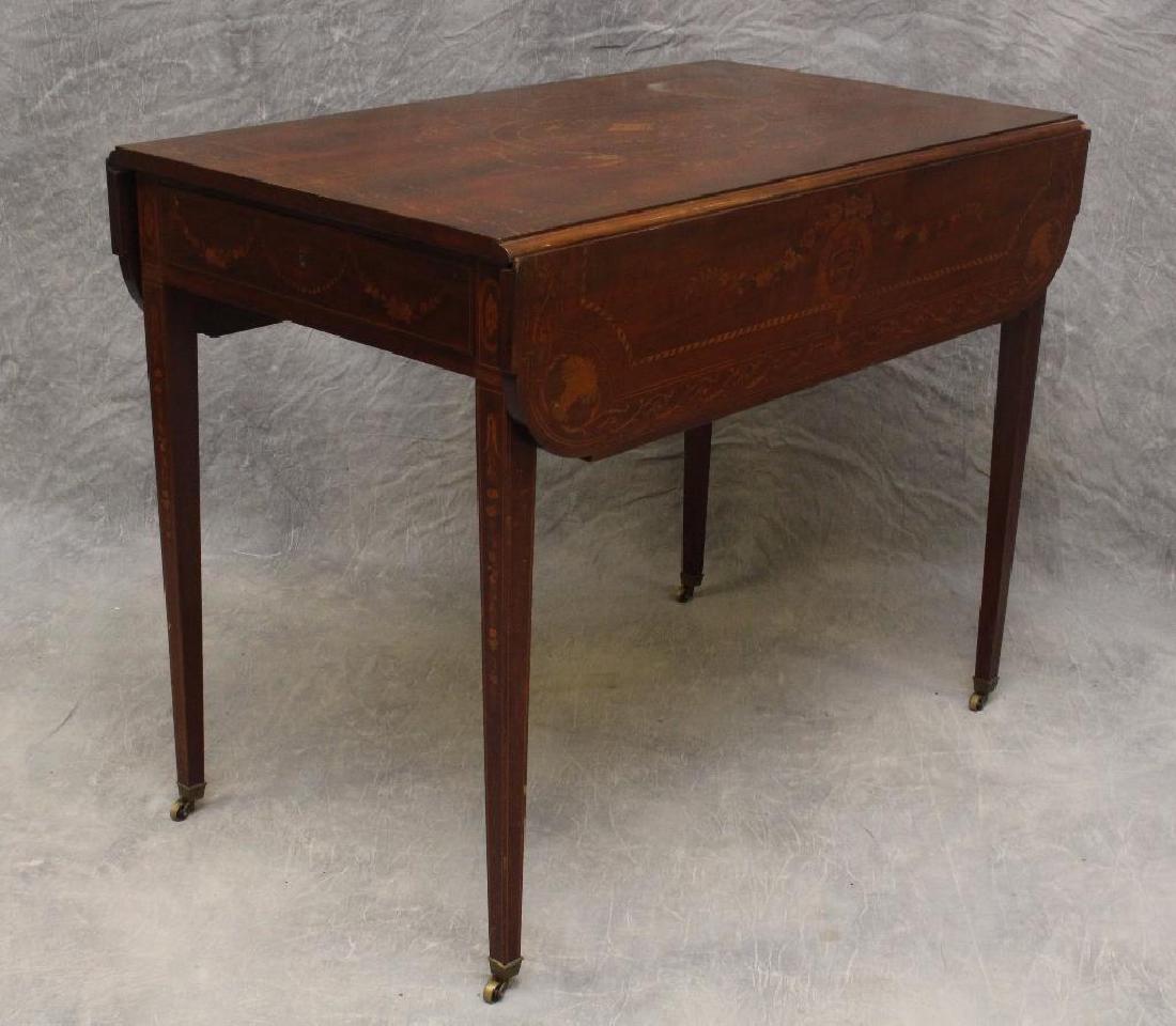 Hepplewhite Mahogany and Marquetry Pembroke Table: Elliptical top with, urn, bell flower, and banded inlay, one drawer on tapered legs on casters, 29.5"h x 38"w x 36.5"d.
